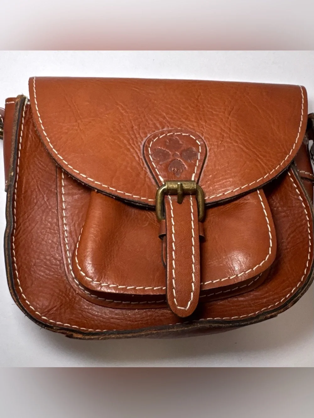 Patricia Nash Bonella Mini Crossbody Saddle Bag in their signature tan/cognac